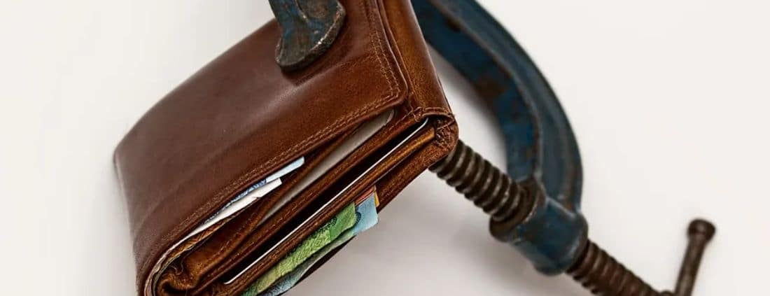 Wallet in a vice grip.