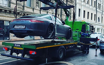 Car being towed for reposession